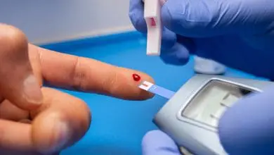 A closeup shot of a doctor with rubber gloves taking a blood test from a patient with diabetes