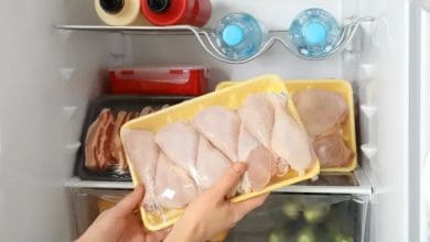 a raw chicken in a fridge